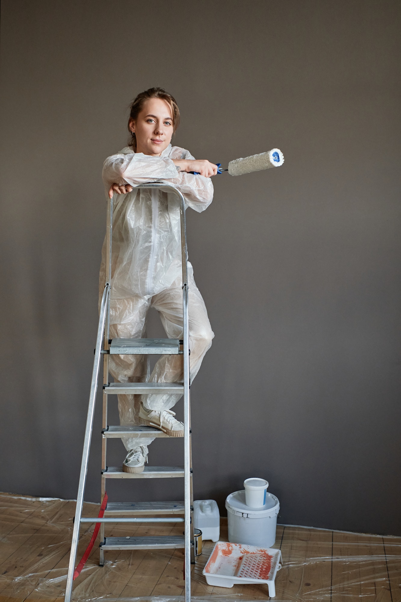 Young Woman Renovating Apartment